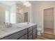Bright bathroom featuring a double sink vanity, a walk-in shower, and closet at 54 Barony Ln, Smithfield, NC 27577