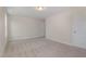 A bright bedroom includes neutral paint, carpet and entry to another room at 54 Barony Ln, Smithfield, NC 27577