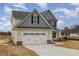 Lovely home boasts a two-car garage, well-maintained lawn, and inviting entrance at 54 Barony Ln, Smithfield, NC 27577