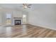 Bright living room with wood floors, fireplace, and ample natural light from the windows at 54 Barony Ln, Smithfield, NC 27577