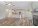 Inviting open-concept space connects the kitchen to living room, highlighted by wood floors and modern lighting at 54 Barony Ln, Smithfield, NC 27577