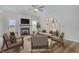 Cozy living room features wood floors, a fireplace, and stylish decor, virtually staged for inspiration at 54 Barony Ln, Smithfield, NC 27577