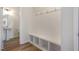Mudroom with bench and storage cubbies, complemented by a nearby pedestal sink and bathroom at 54 Barony Ln, Smithfield, NC 27577