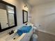 Bathroom with double sink vanity with ample counter space and shower at 56 Bailey-Boykin Rd, Selma, NC 27576