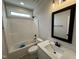 Bathroom features a single sink vanity and a shower/tub combo at 56 Bailey-Boykin Rd, Selma, NC 27576