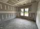 Bedroom with natural light streaming in through large windows, ideal for relaxation at 56 Bailey-Boykin Rd, Selma, NC 27576