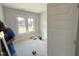 Unfinished bedroom with view to the outside with great natural light and a closet door at 56 Bailey-Boykin Rd, Selma, NC 27576