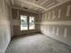 Well-lit bedroom featuring large windows, ready for finishing and personal touches at 56 Bailey-Boykin Rd, Selma, NC 27576
