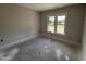 Bright bedroom with natural light streaming through the double windows, showcasing a blank canvas for personalization at 56 Bailey-Boykin Rd, Selma, NC 27576