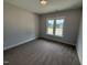 Bedroom with neutral paint and carpet at 56 Bailey-Boykin Rd, Selma, NC 27576