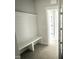 Functional entryway with built-in bench and storage; tiled floor leads into the rest of the home at 56 Bailey-Boykin Rd, Selma, NC 27576