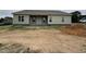 New construction home featuring sage green siding and a covered back porch at 56 Bailey-Boykin Rd, Selma, NC 27576
