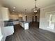 Modern kitchen with white cabinetry, center island, and pendant lighting at 56 Bailey-Boykin Rd, Selma, NC 27576