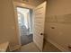 Well-lit laundry room with tile floors at 56 Bailey-Boykin Rd, Selma, NC 27576