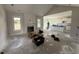 Spacious living room and kitchen area with white cabinetry and modern finishes under construction at 56 Bailey-Boykin Rd, Selma, NC 27576