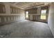 Spacious main bedroom with ample natural light from large windows ready for finishing touches at 56 Bailey-Boykin Rd, Selma, NC 27576