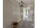 Unfurnished room with a modern black chandelier and view to another bright room at 56 Bailey-Boykin Rd, Selma, NC 27576