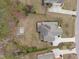 Aerial view of a well-maintained property with a basketball court in the spacious backyard at 5928 Terrington Ln, Raleigh, NC 27606