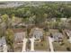 Aerial view of homes with well manicured lawns and landscaping in a lush green area at 5928 Terrington Ln, Raleigh, NC 27606