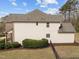 View of backyard featuring grass, bushes, privacy fence and the side of a home at 5928 Terrington Ln, Raleigh, NC 27606