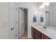 Bathroom with cherry vanity, white countertop, and stylish fixtures at 5928 Terrington Ln, Raleigh, NC 27606