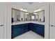 Elegant bathroom with dual sinks, brass hardware, and a large, decorative mirror at 5928 Terrington Ln, Raleigh, NC 27606
