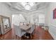 Open dining room with hardwood floors, coffered ceiling, chandelier, and access to living spaces at 5928 Terrington Ln, Raleigh, NC 27606