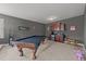 An entertainment room with a pool table, wet bar, and fun decor at 5928 Terrington Ln, Raleigh, NC 27606