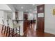 Spacious kitchen with dark cabinets, granite countertops, and hardwood flooring, perfect for entertaining at 5928 Terrington Ln, Raleigh, NC 27606