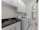 Well-equipped laundry room with ample storage and modern appliances at 5928 Terrington Ln, Raleigh, NC 27606