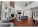 Bright living room with hardwood floors, fireplace, custom built-ins, and a soaring ceiling at 5928 Terrington Ln, Raleigh, NC 27606