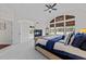 Inviting main bedroom featuring a cozy seating area, fireplace, and large windows with natural light at 5928 Terrington Ln, Raleigh, NC 27606