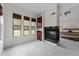 Comfortable sitting area featuring a fireplace, built-in cabinets and natural light from the surrounding windows at 5928 Terrington Ln, Raleigh, NC 27606