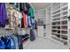 Organized walk-in closet with ample shelving and hanging space for clothes and shoes at 5928 Terrington Ln, Raleigh, NC 27606