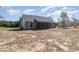 Rear exterior view of home with screened in porch and large yard at 609 Tuscany Cir, Princeton, NC 27569