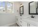 Bathroom featuring double sinks, and granite countertops at 609 Tuscany Cir, Princeton, NC 27569