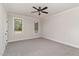 Bright bedroom with carpet flooring, ceiling fan, and natural light at 609 Tuscany Cir, Princeton, NC 27569