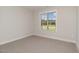 Sunlit bedroom with large window offering natural light at 609 Tuscany Cir, Princeton, NC 27569