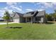Beautifully landscaped single-Gathering home boasting lush green lawn and welcoming curb appeal at 609 Tuscany Cir, Princeton, NC 27569