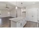 Bright kitchen with granite countertops, an island, and stainless steel appliances at 609 Tuscany Cir, Princeton, NC 27569