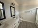 Modern bathroom with double vanity, sleek fixtures, and a tiled shower at 612 Tuscany Cir, Princeton, NC 27569