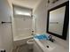 Standard bathroom with tub and shower combo, neutral walls, and a single vanity at 612 Tuscany Cir, Princeton, NC 27569