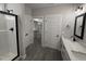 Modern bathroom with dual vanity, glass shower, and large walk-in closet at 612 Tuscany Cir, Princeton, NC 27569