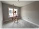 Well-lit bedroom with large windows, offering a clean space with natural light, ready for personal touches at 612 Tuscany Cir, Princeton, NC 27569