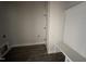 Bright entryway features a wood-look floor, a built-in bench, and white shiplap accent paneling at 612 Tuscany Cir, Princeton, NC 27569