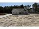 Charming single-story home with a combination of siding and stone accents, plus a new driveway at 612 Tuscany Cir, Princeton, NC 27569