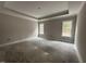 Spacious main bedroom with tray ceiling, offering a blank canvas for creating a serene retreat at 612 Tuscany Cir, Princeton, NC 27569
