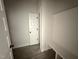 Hallway with a bench and coat hooks offers a convenient storage solution at 612 Tuscany Cir, Princeton, NC 27569