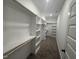 Large walk-in closet with custom shelving and ample storage space at 612 Tuscany Cir, Princeton, NC 27569
