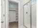 A bathroom with a glass shower door and a walk-in closet at 613 Tuscany Cir, Princeton, NC 27569